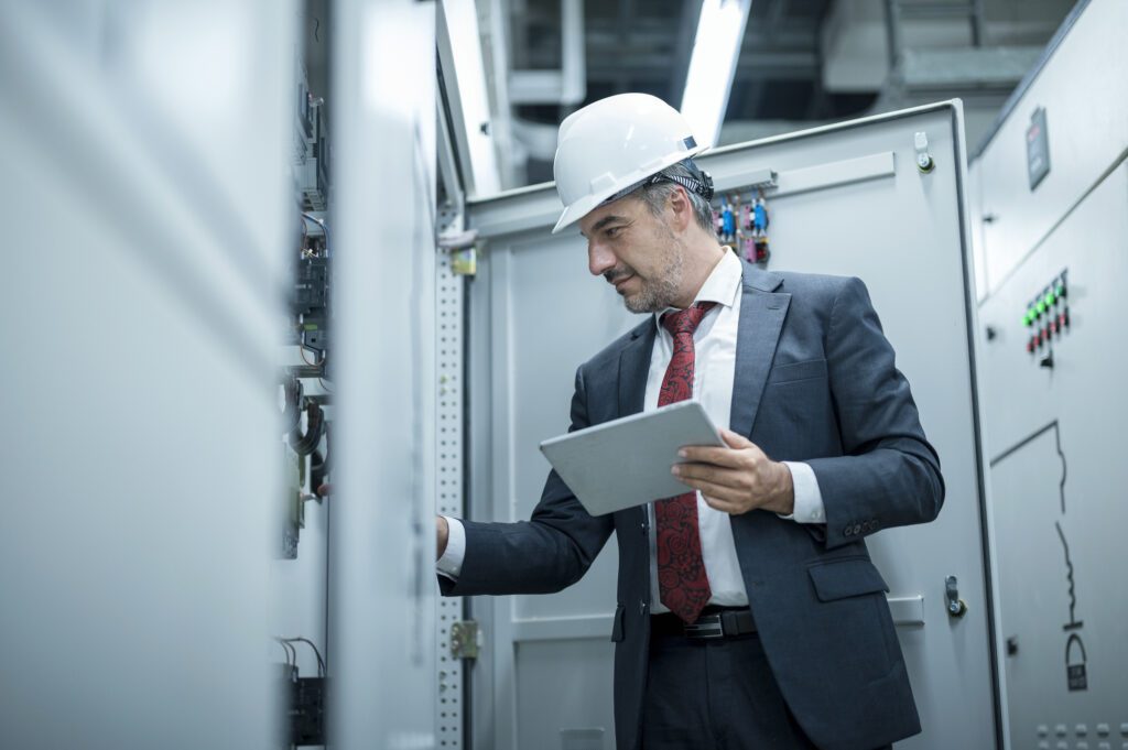 Senior Electrical Engineer Examining Light Indication