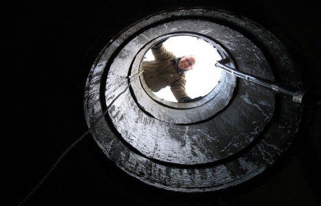 Men Looking at the Hole